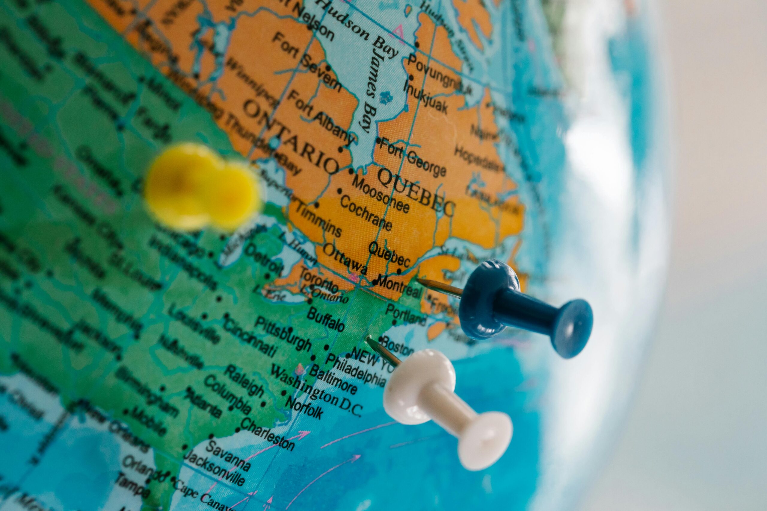 Map of Canadian and USA border with push pins marking areas on the East coast